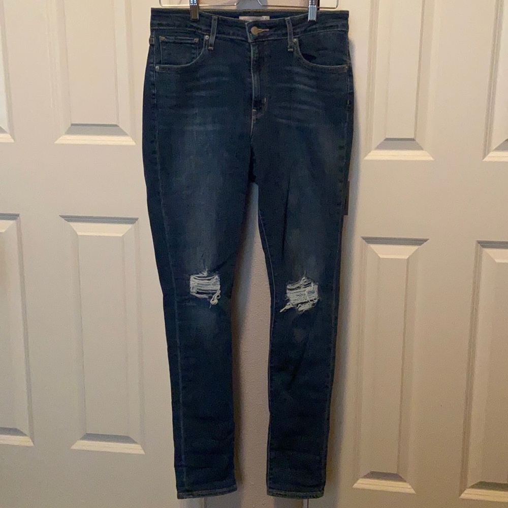 Levi's Women's Skinny Jeans in Dark Blue with Knee Rips